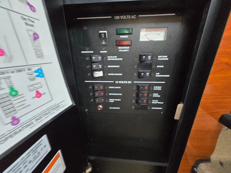 Slide: The Image of Electrical control panel on a 2007 Sea Ray 260 Sundancer boat. - 23