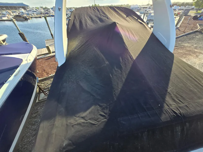 Slide: The Image of 2007 Sea Ray 260 Sundancer covered, docked at marina. - 29