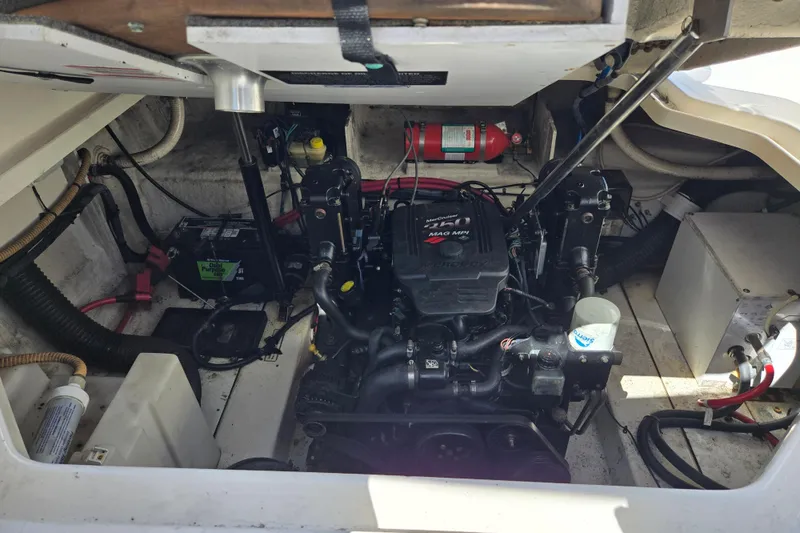 Slide: The Image of Engine compartment of a 2007 Sea Ray 260 Sundancer boat, featuring a MerCruiser engine. - 35