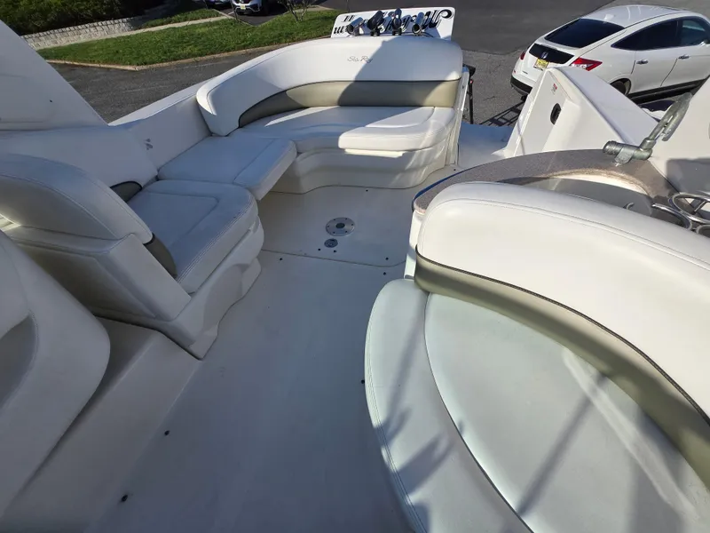 Slide: The Image of 2007 Sea Ray 260 Sundancer boat interior with white seating and dashboard. - 5
