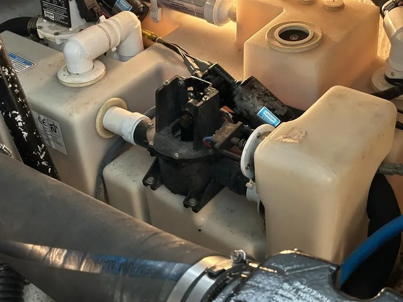 Slide: The Image of Engine compartment of a 2005 Sea Ray 320 Sun Dancer boat, showing mechanical components. - 18