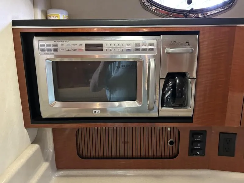 Slide: The Image of Built-in microwave and coffee maker in 2005 Sea Ray 320 Sun Dancer yacht kitchen. - 9