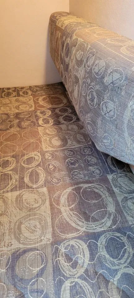 Slide: The Image of 2004 Sea Ray Sundancer 260 interior with patterned upholstery and seating. - 36