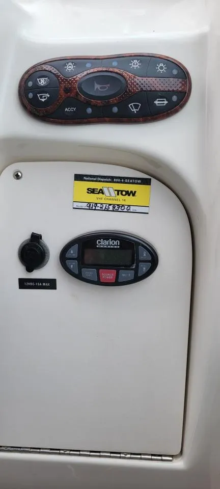 Slide: The Image of Control panel of a 2004 Sea Ray Sundancer 260 boat with Sea Tow sticker. - 37