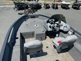 Slide: The Image of 2015 Tracker Pro Guide V-175 SC boat interior with steering console and seating. - 19