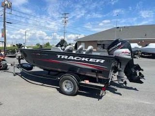 Slide: The Image of 2015 Tracker Pro Guide V-175 SC boat on trailer, parked outdoors. - 4