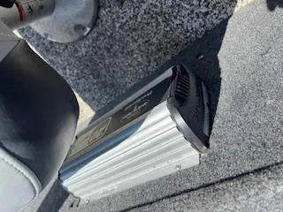 Slide: The Image of 2015 Tracker Pro Guide V-175 SC interior with electronic device on carpeted floor. - 9