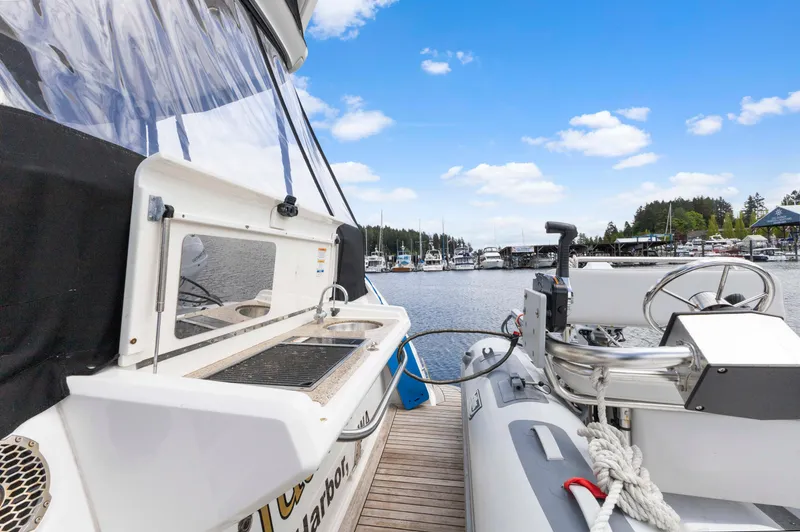 Slide: The Image of 2017 Sea Ray Fly 400 yacht docked at marina with inflatable boat. - 12