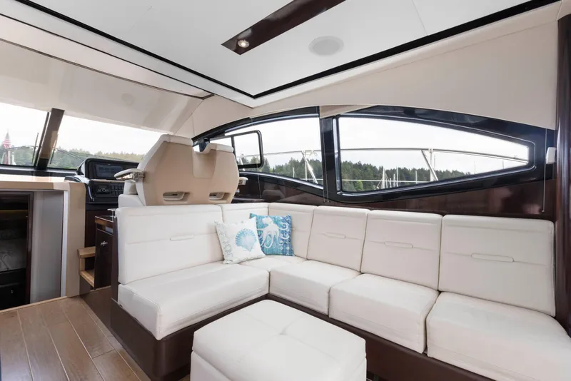 Slide: The Image of Luxurious interior of 2017 Sea Ray Fly 400 yacht with white seating and modern design. - 16