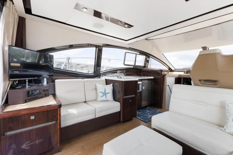 Slide: The Image of Luxurious interior of 2017 Sea Ray Fly 400 yacht with modern seating and entertainment area. - 17