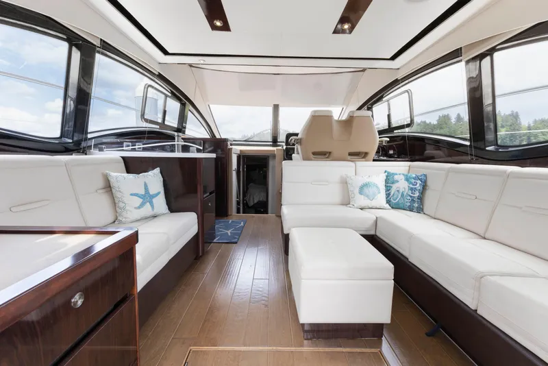 Slide: The Image of Luxurious interior of 2017 Sea Ray Fly 400 yacht with white seating and nautical decor. - 2