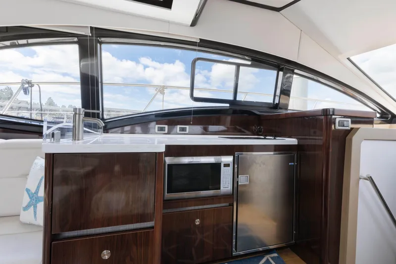 Slide: The Image of Luxurious 2017 Sea Ray Fly 400 yacht interior with modern kitchen amenities and sleek design. - 20