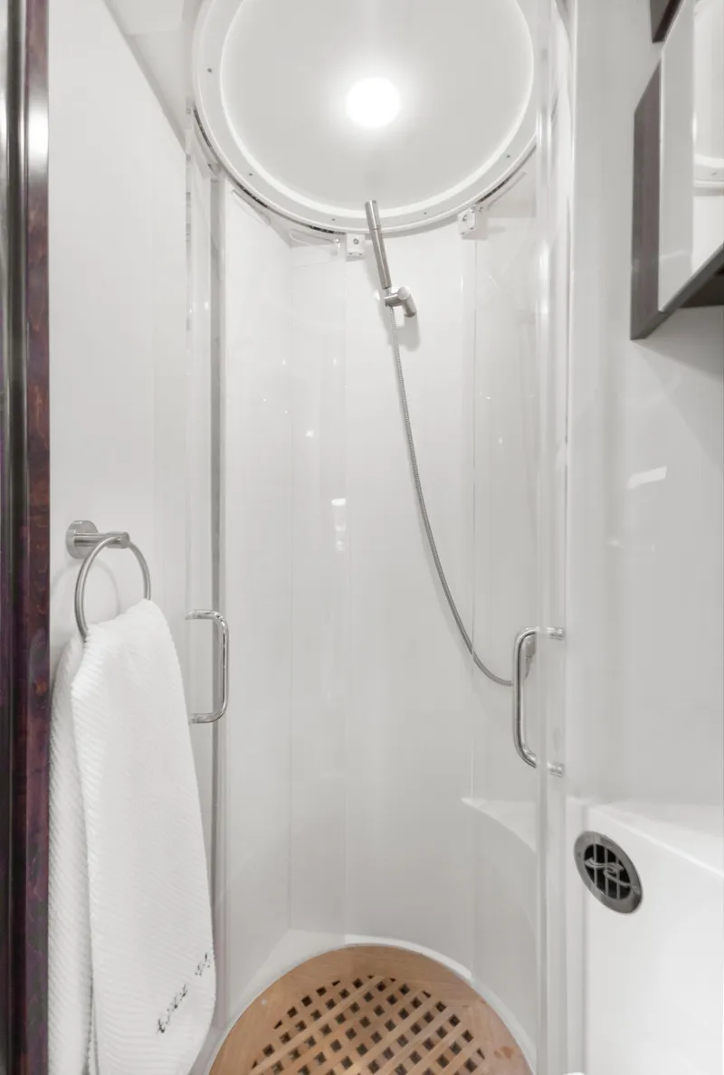 Slide: The Image of Shower area in 2017 Sea Ray Fly 400 yacht, featuring modern fixtures and a towel rack. - 22