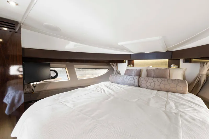 Slide: The Image of Luxurious bedroom interior of 2017 Sea Ray Fly 400 yacht with modern design and cozy bedding. - 25