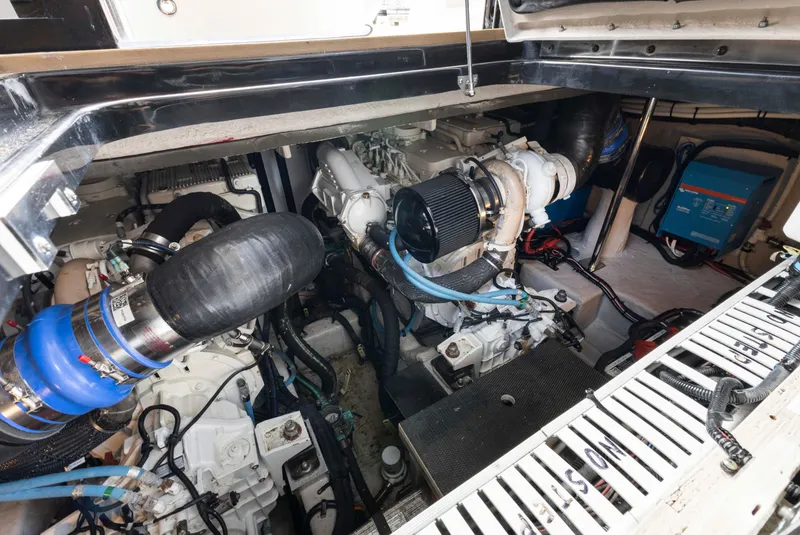 Slide: The Image of Engine compartment of 2017 Sea Ray Fly 400 yacht, showcasing mechanical components and systems. - 31