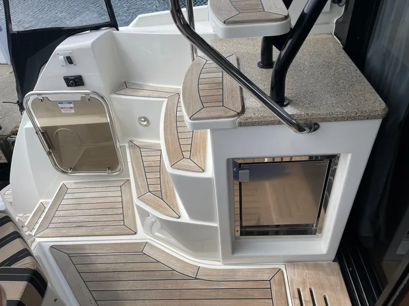 Slide: The Image of 2017 Sea Ray Fly 400 yacht deck with steps and storage compartment. - 50