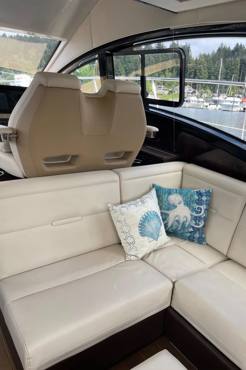 Slide: The Image of Interior of 2017 Sea Ray Fly 400 yacht with beige seating and decorative pillows. - 65