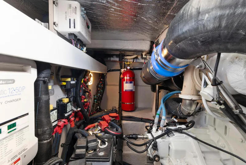 Slide: The Image of Engine room of 2017 Sea Ray Fly 400 with fire extinguisher and electrical components. - 67