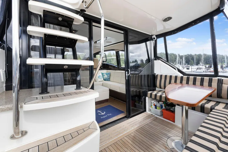 Slide: The Image of Interior of 2017 Sea Ray Fly 400 yacht with seating and stairs. - 7