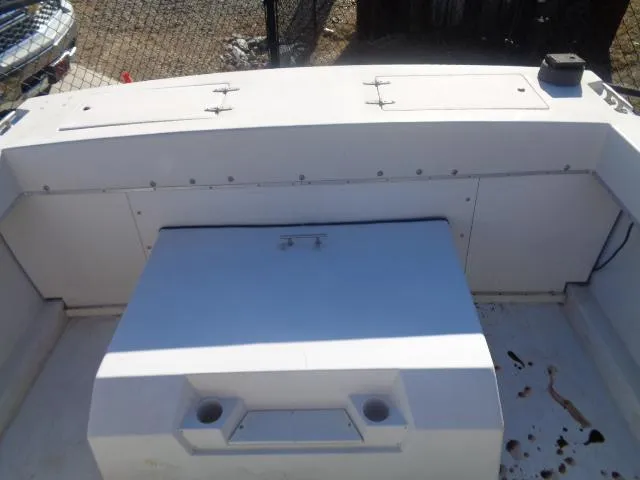 Slide: The Image of 1980 Grady-White 241 WEEKENDER boat interior with storage compartments and seating area. - 10