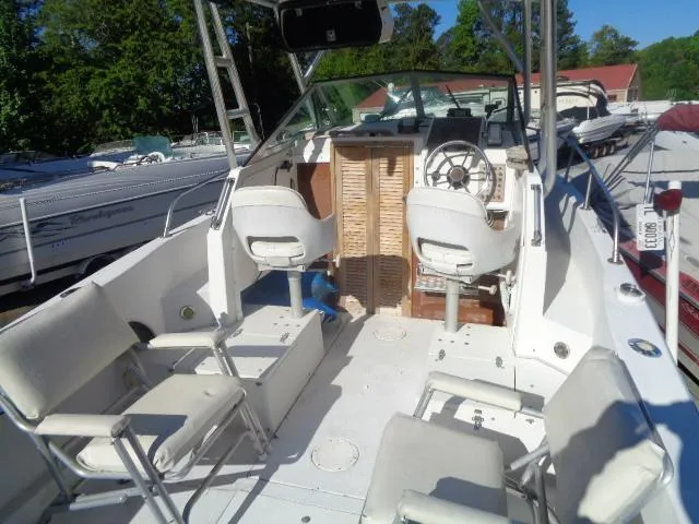 Slide: The Image of 1980 Grady-White 241 WEEKENDER boat interior with seating and steering wheel. - 11