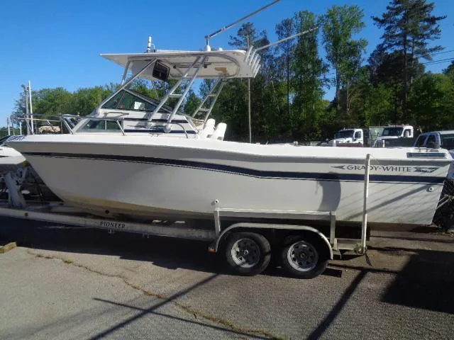 Slide: The Image of 1980 Grady-White 241 WEEKENDER boat on trailer, parked outdoors. - 3