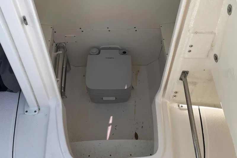 Slide: The Image of Portable toilet in 2021 Robalo R242 Explorer boat compartment. - 15