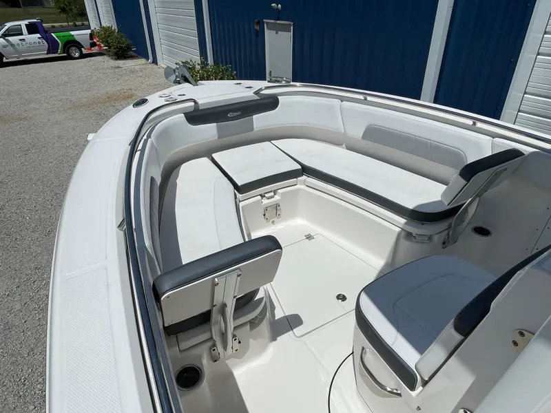 Slide: The Image of 2021 Robalo R242 Explorer boat interior with spacious seating and modern design. - 7