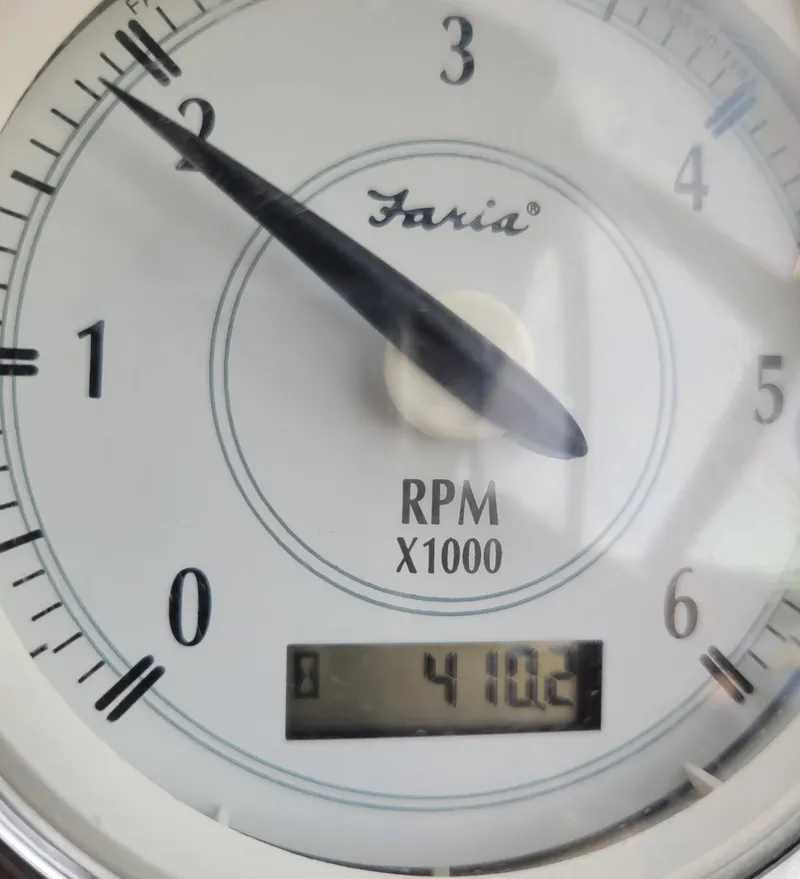 Slide: The Image of Close-up of a Faria tachometer showing 2,100 RPM on a 2006 Regal 3060 Window Express. - 22