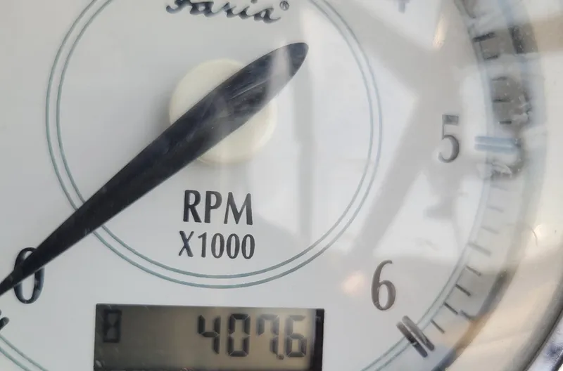 Slide: The Image of Close-up of a 2006 Regal 3060 Window Express RPM gauge reading 4076. - 23