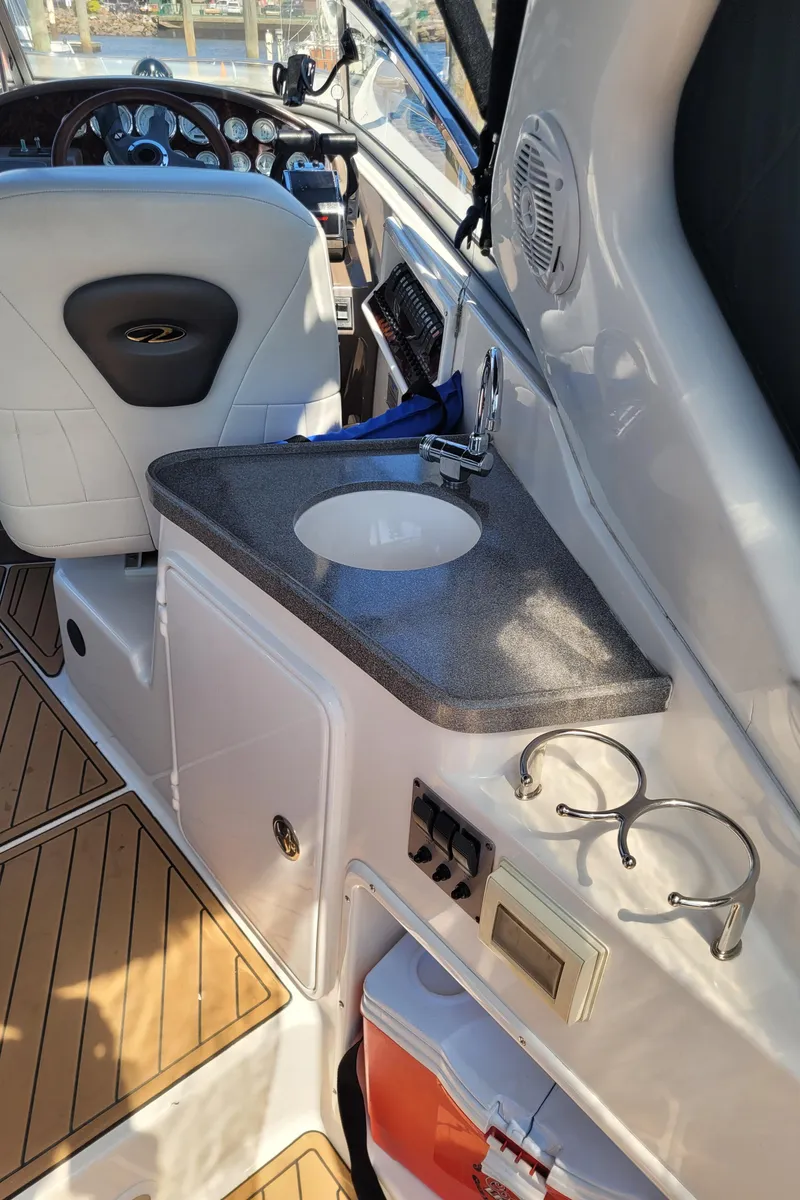 Slide: The Image of 2006 Regal 3060 Window Express boat interior with sink and control panel. - 26