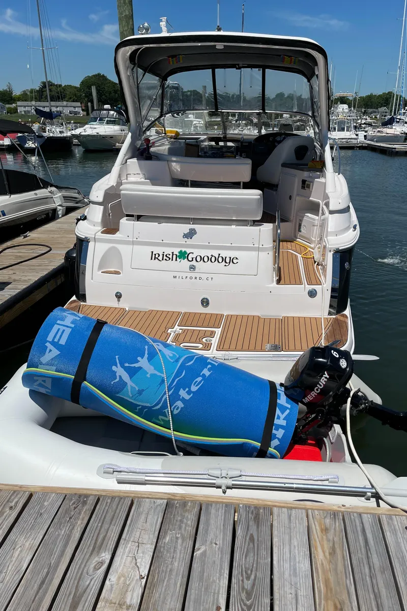 Slide: The Image of 2006 Regal 3060 Window Express boat docked with water sports gear on deck. - 4