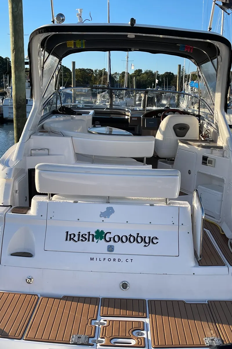Slide: The Image of 2006 Regal 3060 Window Express boat docked, featuring "Irish Goodbye" nameplate. - 5