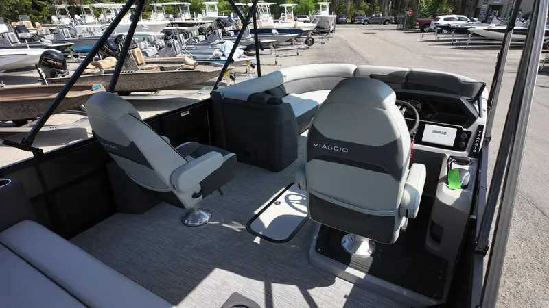 Slide: The Image of Interior of 2025 Viaggio Z22S boat with modern seating and steering console. - 32