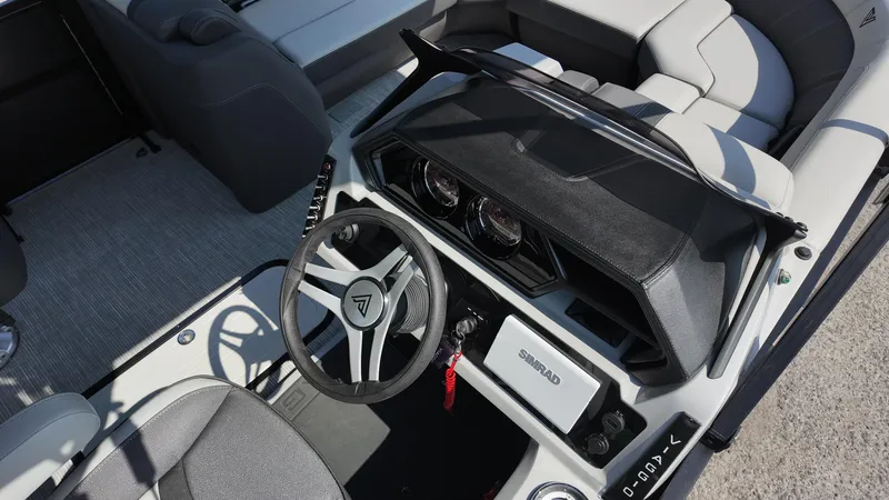 Slide: The Image of Interior view of 2025 Viaggio Z22S boat, featuring modern steering and dashboard design. - 34