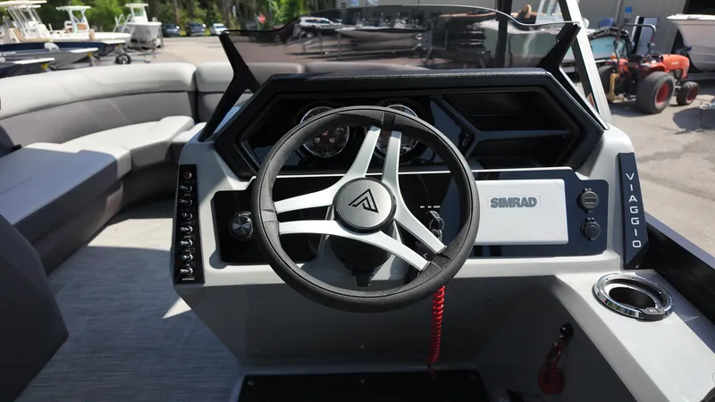 Slide: The Image of 2025 Viaggio Z22S boat dashboard with steering wheel and Simrad display. - 42