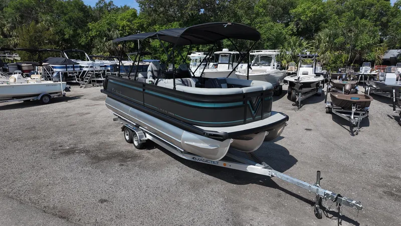 Slide: The Image of 2025 Viaggio Z22S pontoon boat on trailer in outdoor showroom. - 5