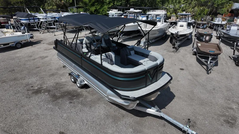 Slide: The Image of 2025 Viaggio Z22S pontoon boat on trailer in a marina setting. - 6