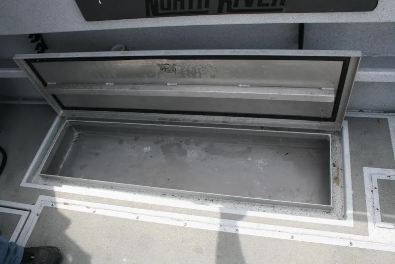 Slide: The Image of Open storage compartment on 2017 North River 2500 S Sew Hawk OS boat. - 11