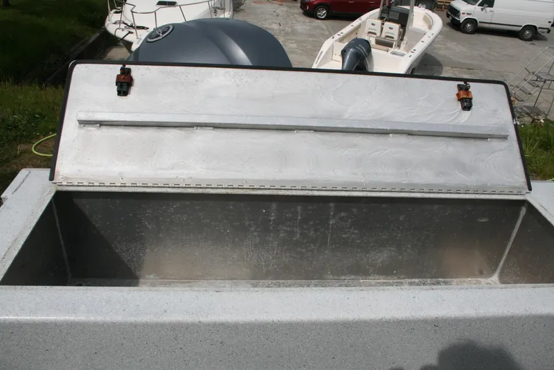 Slide: The Image of Open storage compartment on a 2017 North River 2500 S Sew Hawk OS boat. - 14