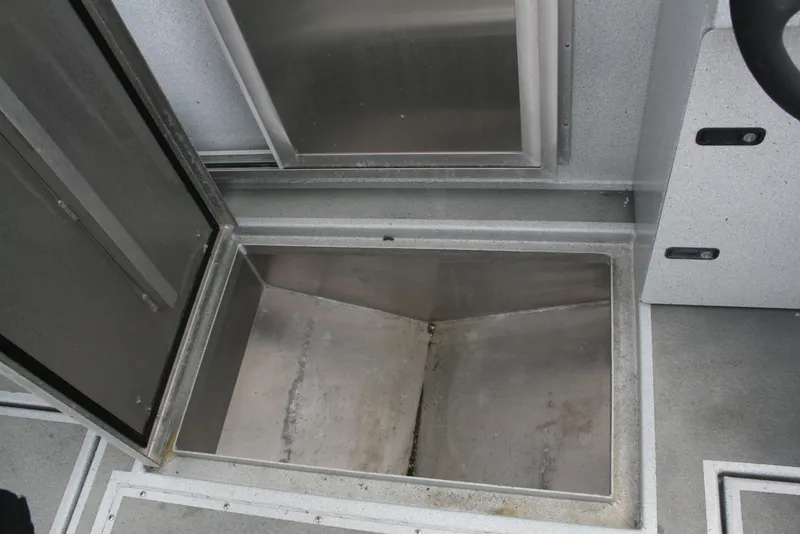 Slide: The Image of Open storage compartment in 2017 North River 2500 S Sew Hawk OS boat. - 16