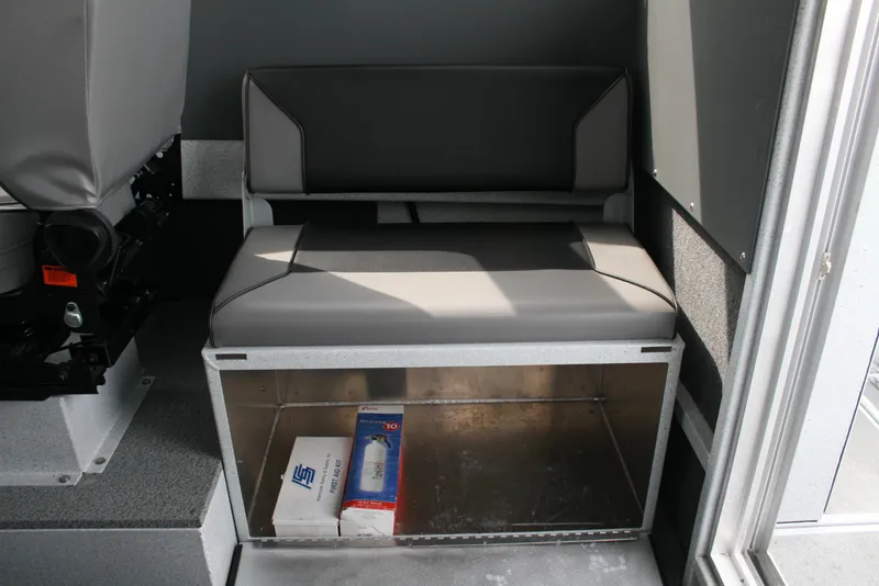 Slide: The Image of 2017 North River 2500 S Sew Hawk OS interior seating with storage compartment. - 18