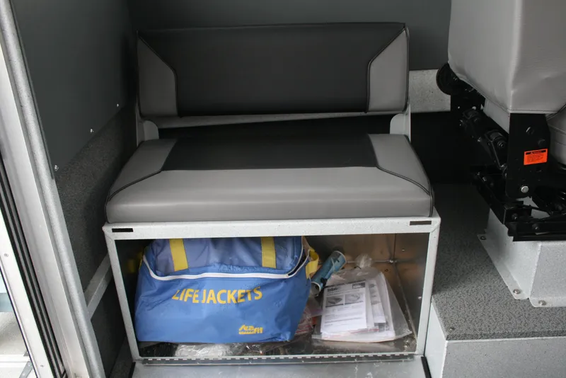 Slide: The Image of Interior of 2017 North River 2500 S Sew Hawk OS with storage bench and life jackets. - 19