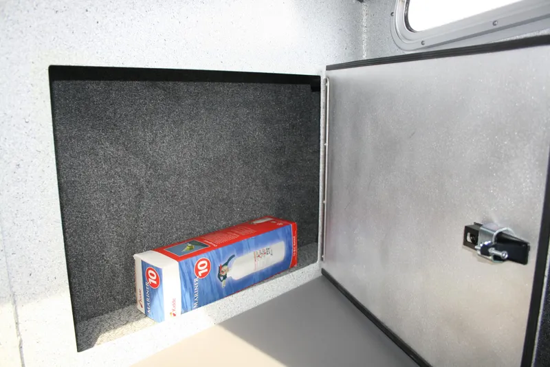Slide: The Image of Storage compartment in a 2017 North River 2500 S Sew Hawk OS boat. - 24