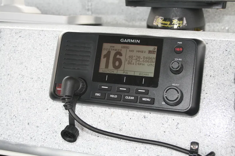 Slide: The Image of Garmin marine radio on 2017 North River 2500 S Sew Hawk OS boat dashboard. - 27