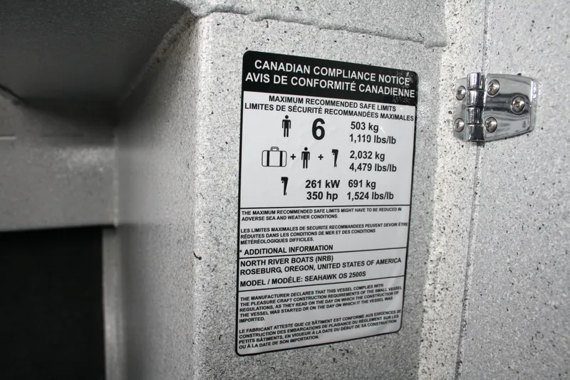 Slide: The Image of Canadian compliance notice on 2017 North River 2500 S Sew Hawk OS boat. - 32