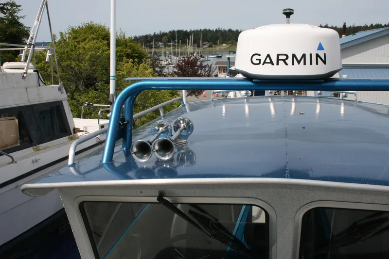 Slide: The Image of 2017 North River 2500 S Sew Hawk OS boat with Garmin radar, docked in a marina. - 38