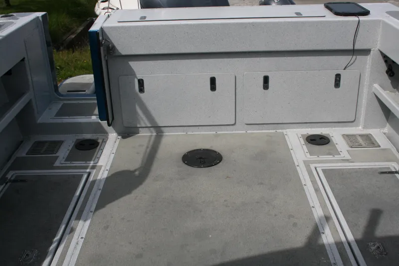 Slide: The Image of 2017 North River 2500 S Sew Hawk OS boat interior with storage compartments. - 40