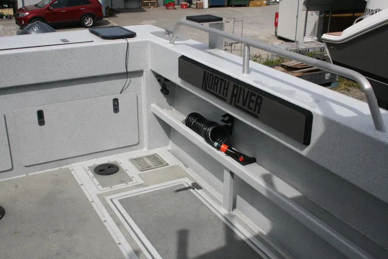 Slide: The Image of 2017 North River 2500 S Sew Hawk OS boat interior with storage and equipment. - 43