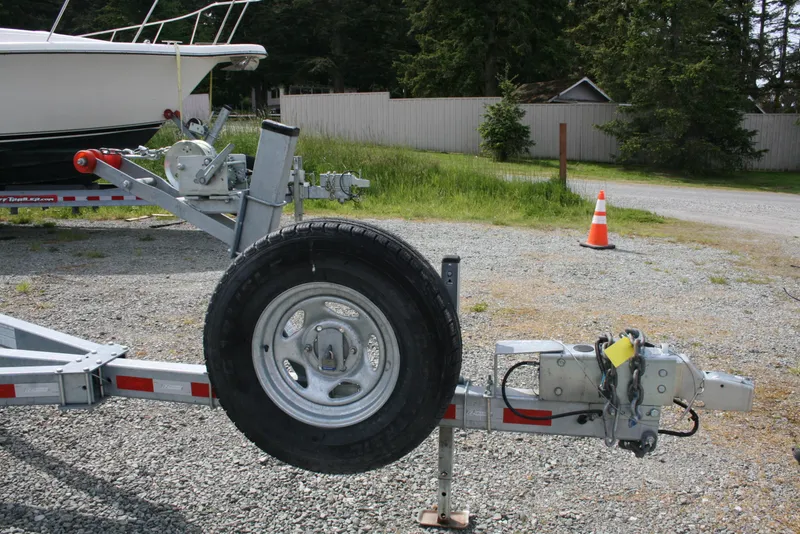 Slide: The Image of Trailer hitch and spare tire for 2017 North River 2500 S Sew Hawk OS boat. - 46